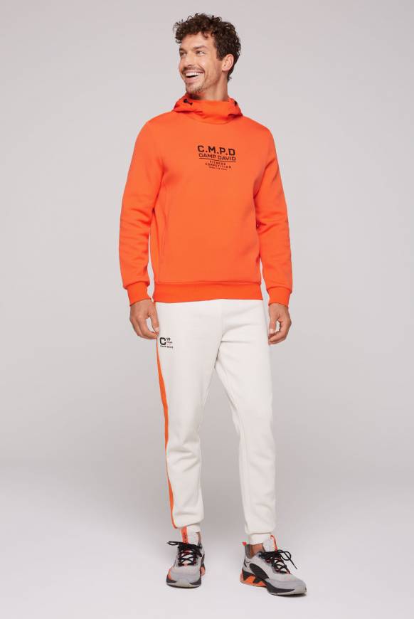 Soccx Hoodie im Materialmix mit Artwork und Rückentasche signal orange Letzte 3 Tage
