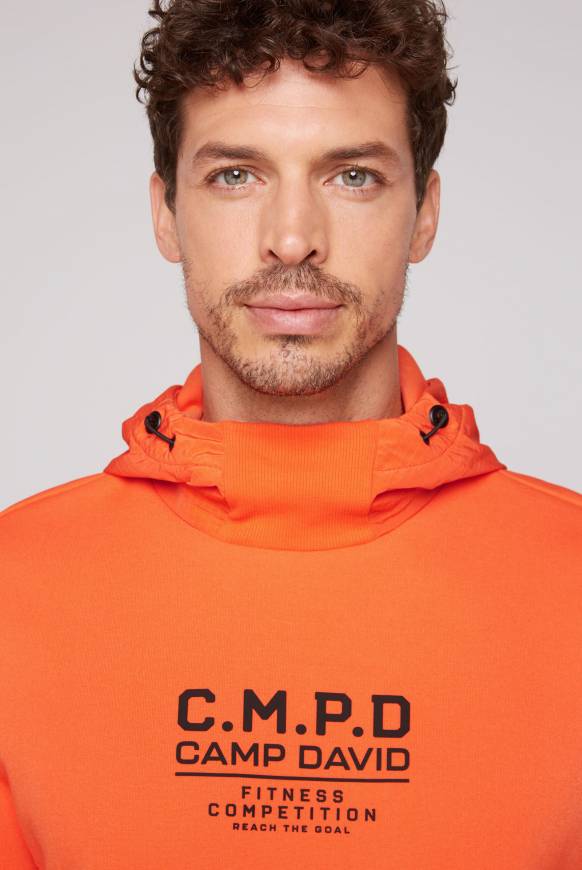 Soccx Hoodie im Materialmix mit Artwork und Rückentasche signal orange Clearance-Verkauf